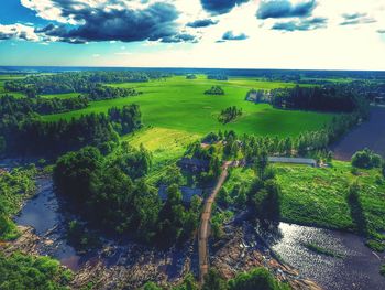 Scenic view of landscape against cloudy sky