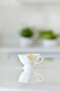 Close-up of coffee cup on table