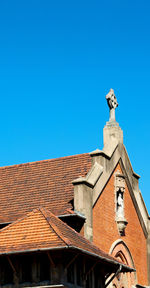 Low angle view of building against clear blue sky