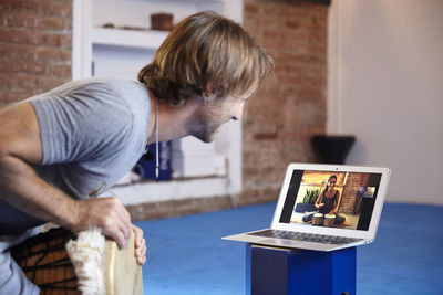 Man video conferencing at home