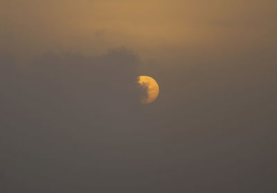 Scenic view of moon at sunset