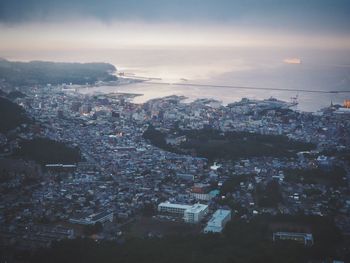 Aerial view of cityscape against sky