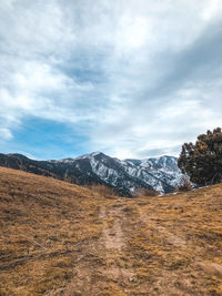 Scenic view of snowcapped mountains against sky