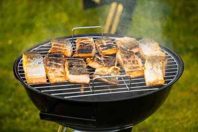 High angle view of meat on barbecue grill