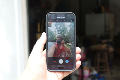 Close-up of hand holding smart phone