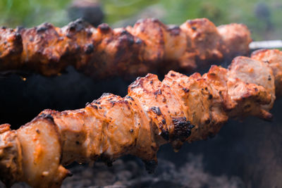 Close-up of meat on barbecue grill