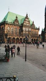 Tourists in front of historic building