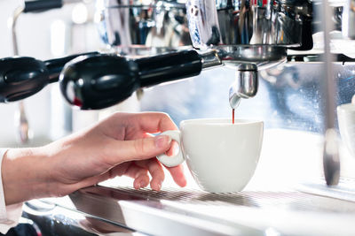 Close-up of coffee cup on table at cafe