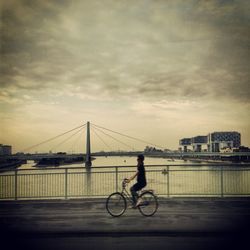 View of bridge against cloudy sky