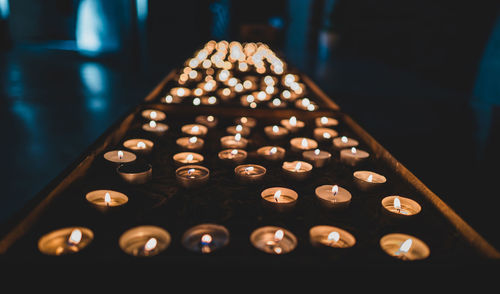 Close-up of candles in church