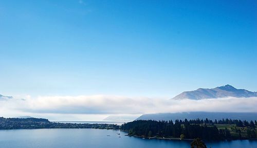 Scenic view of mountains against cloudy sky