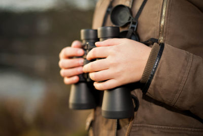 Close-up of man holding camera