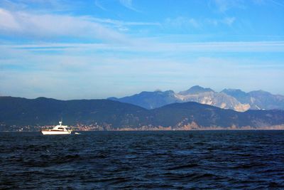 Boat sailing in sea against sky