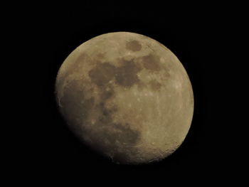 Low angle view of moon against clear sky at night