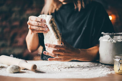 Midsection of woman drinking coffee