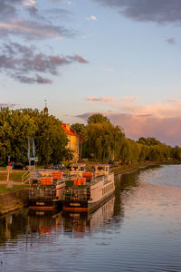 Scenic view of the river against the sky at sunset