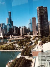 Modern buildings in city against sky