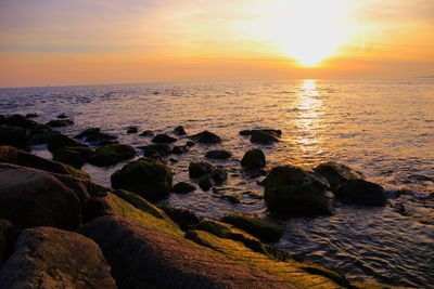 Scenic view of sea against sky during sunset