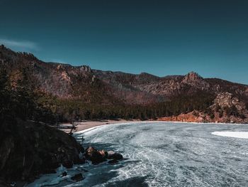 Scenic view of rocky mountains against clear sky