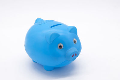 Close-up of blue toy over white background