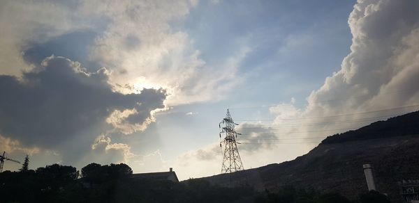 Low angle view of communications tower against sky