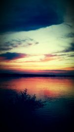 Scenic view of sea against romantic sky at sunset