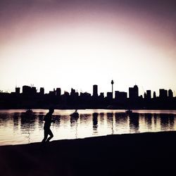 People in water at sunset