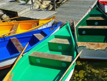 High angle view of multi colored boats moored at pier