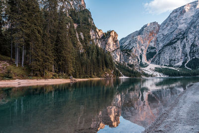 Reflection of trees in lake against sky