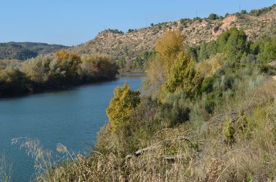 Scenic view of lake with mountains in background