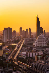 High angle view of buildings against sky during sunset