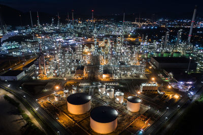 High angle view of illuminated buildings in city at night