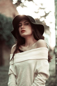 Portrait of beautiful woman wearing hat