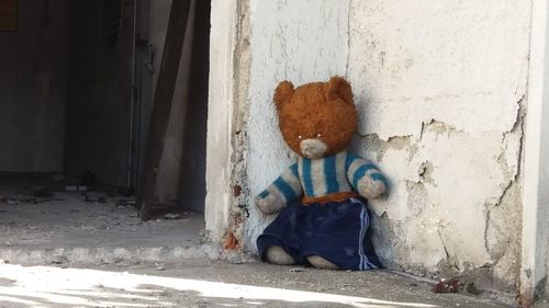 Boy sitting on wall