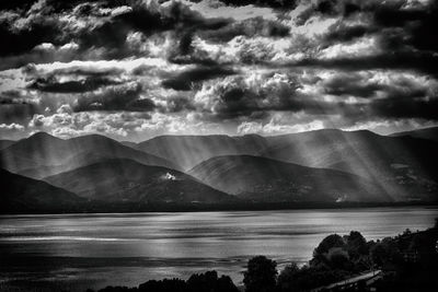 Scenic view of mountains against cloudy sky