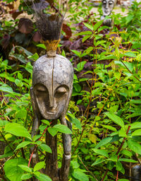 Close-up of statue against plants