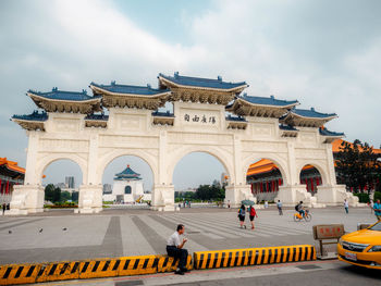 People in front of historical building