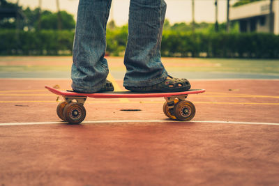 Low section of man skateboarding on skateboard