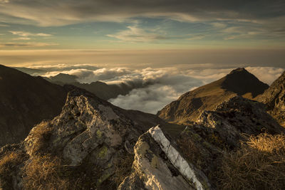 Scenic view of silhouette mountains against sky during sunset