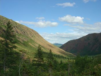 Idyllic view of green mountains against sky