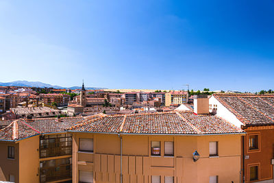 High angle view of townscape against blue sky