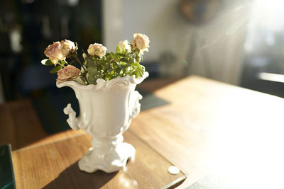 Close-up of white rose on table