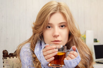 Portrait of woman drinking drink