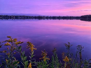 Scenic view of lake against sky during sunset