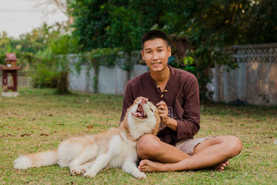 Portrait of young man sitting on a horse