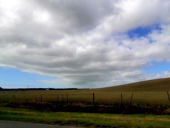 Scenic view of agricultural field against sky