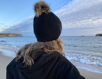 Rear view of woman looking at sea shore