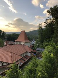 High angle view of houses and trees against sky