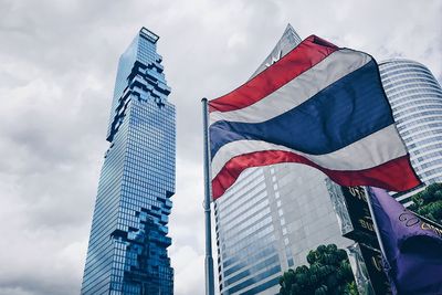 Low angle view of modern buildings against sky in city