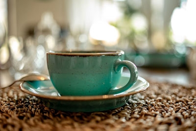 Close-up of coffee cup on table